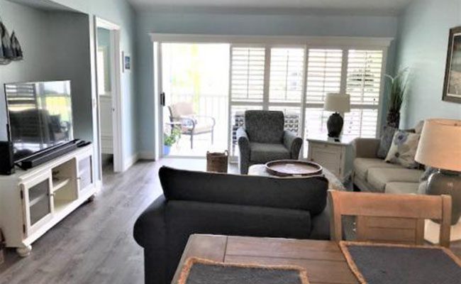 A living room with two chairs and a table