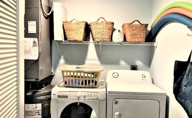 A white washer and dryer in a room.
